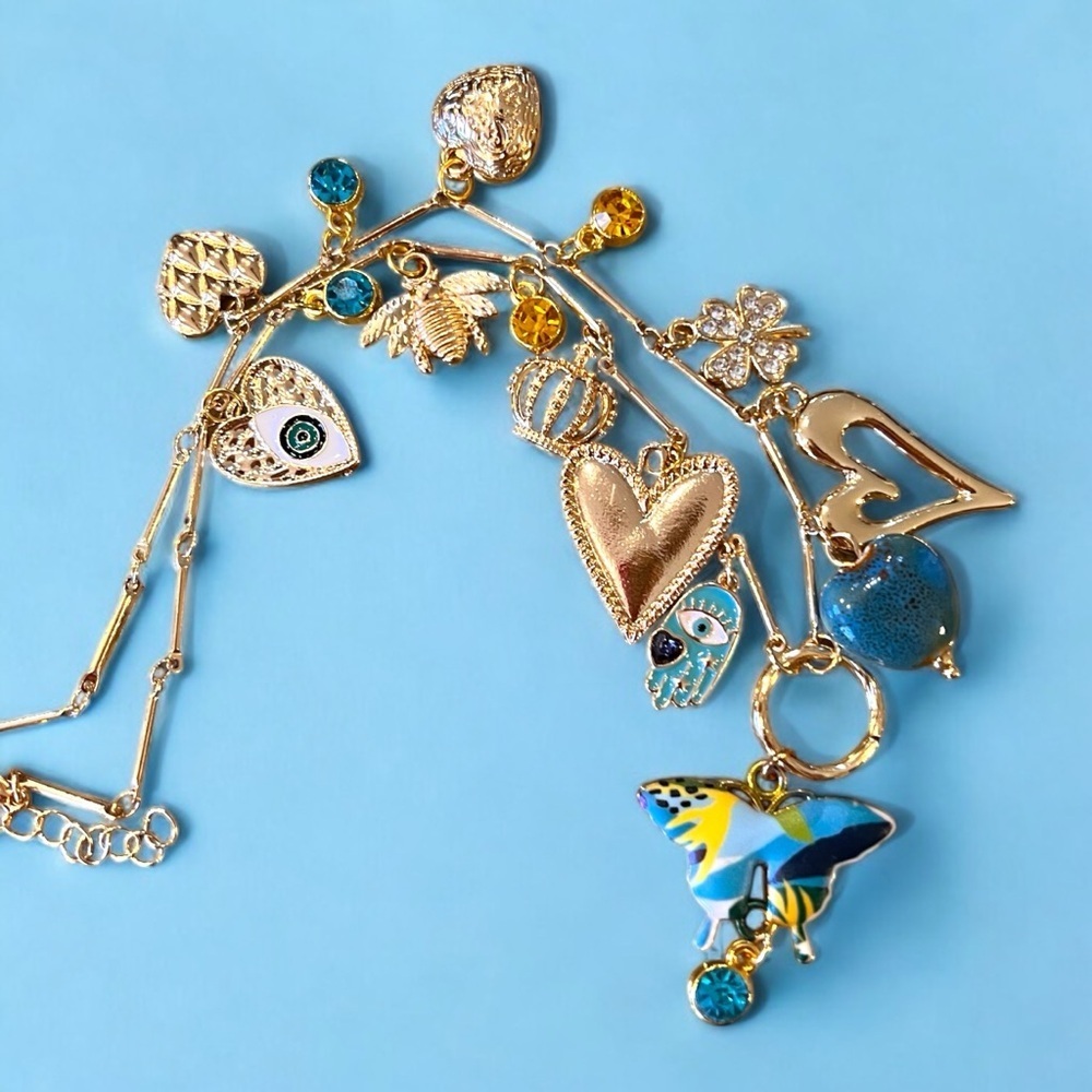 Unique and Gorgeous Gold toned Necklace with Varying Blue and Yellow Charms